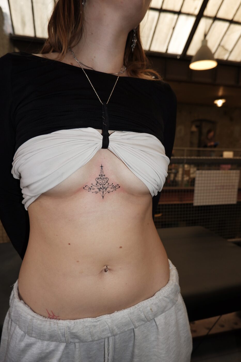 sternum ornament tattoo