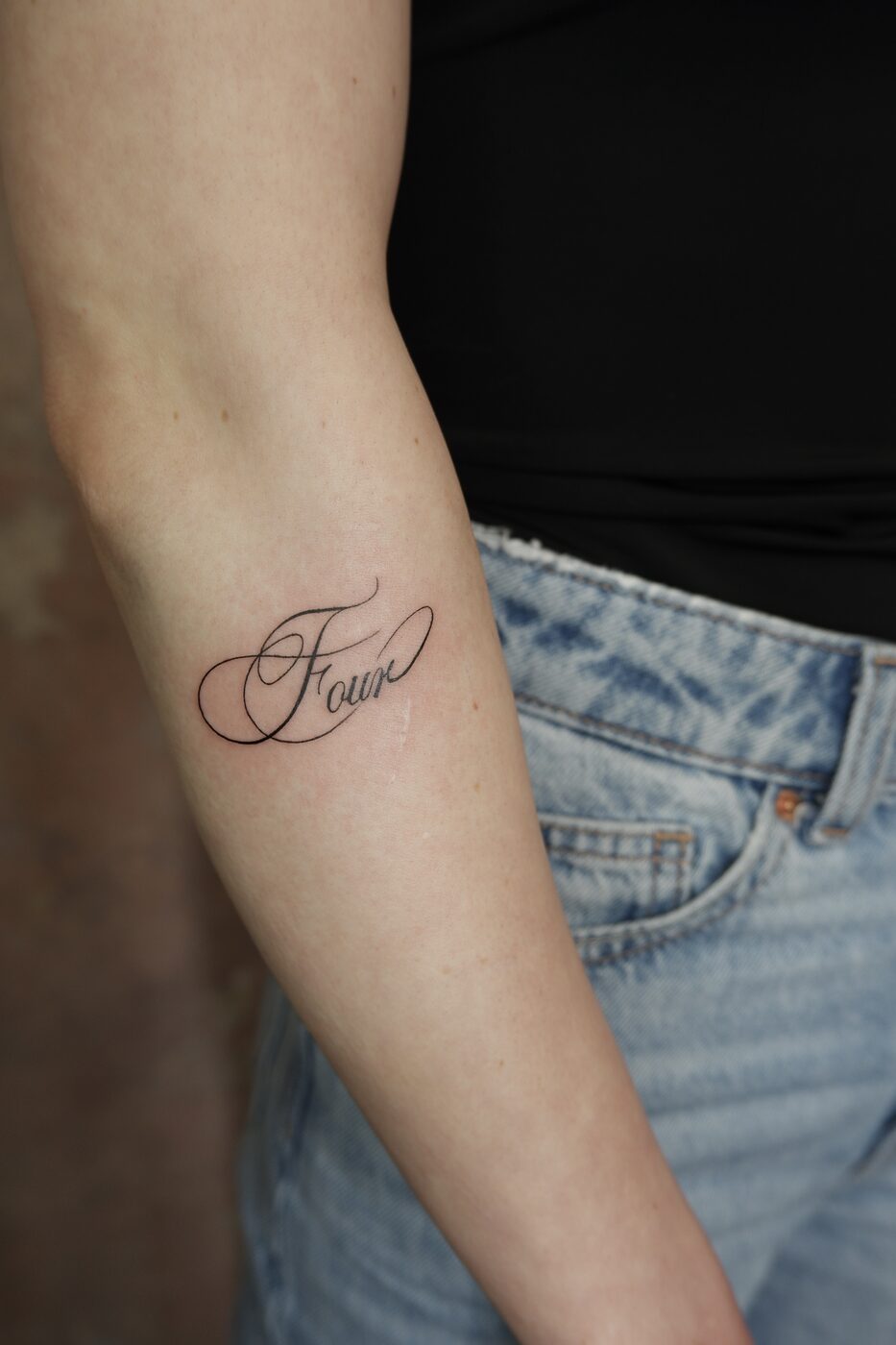 four script tattoo