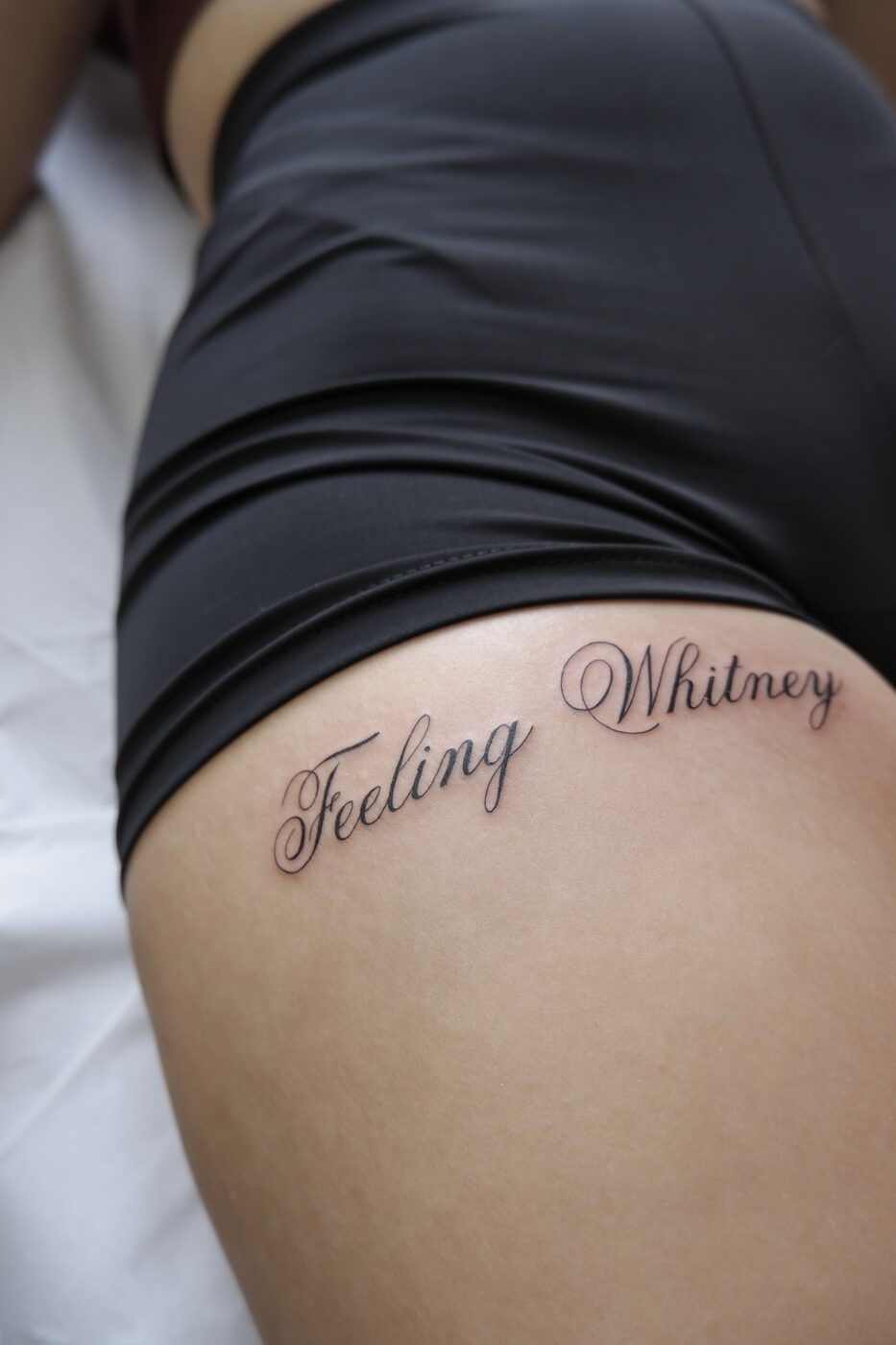 Feeling Whitney script tattoo