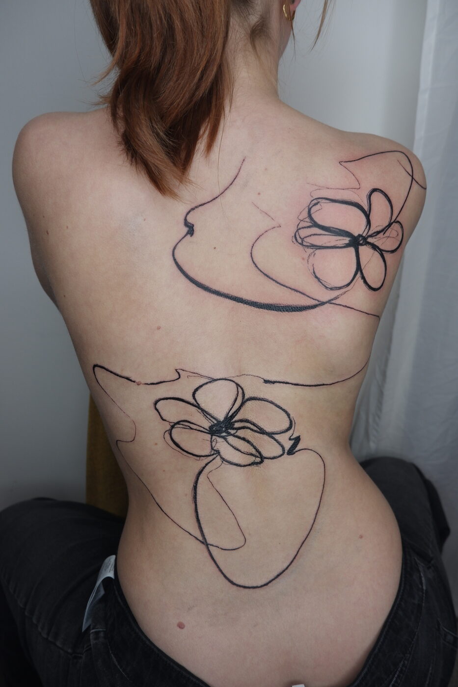 back flowers linework tattoo