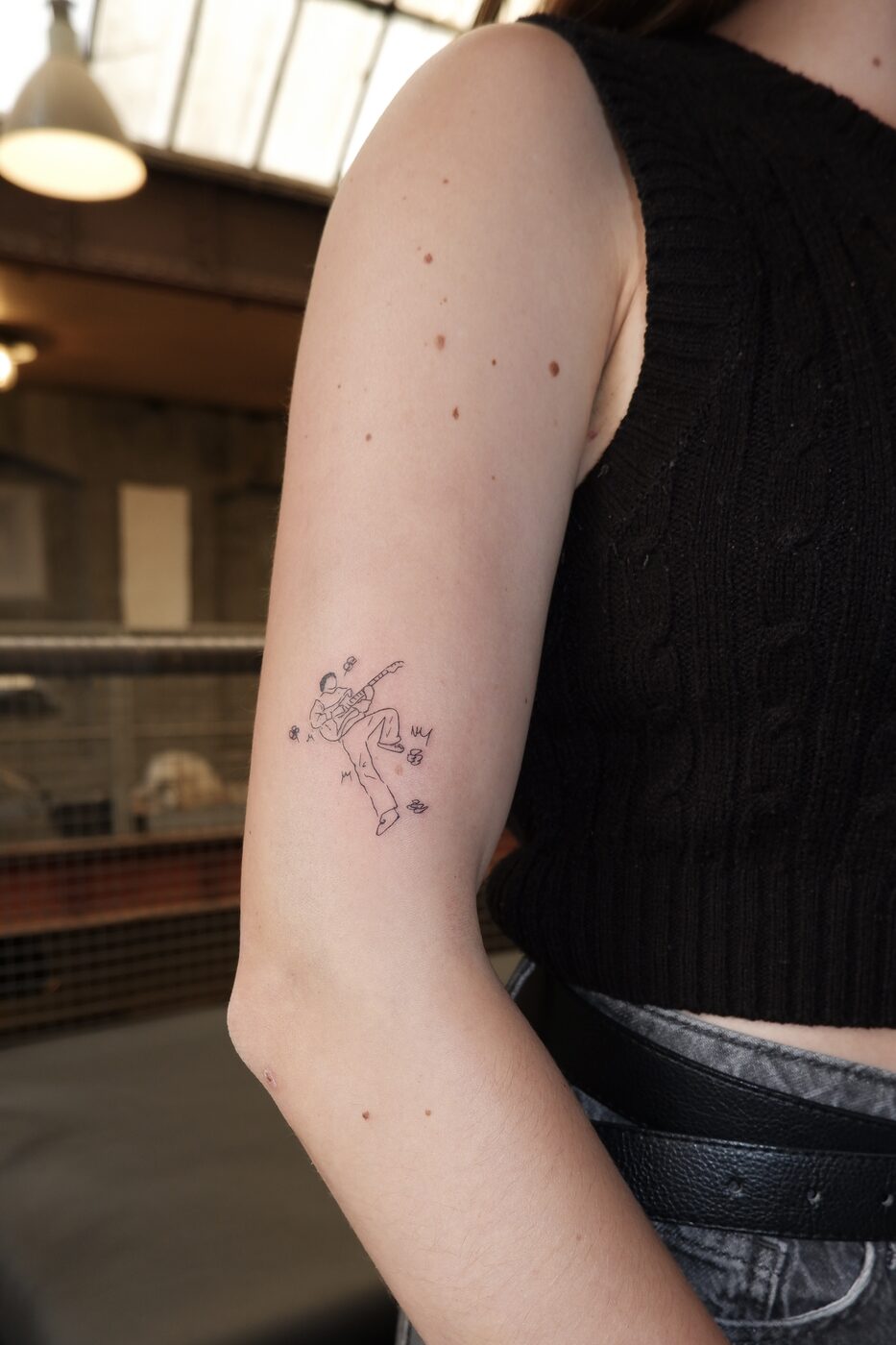 guitar player tattoo
